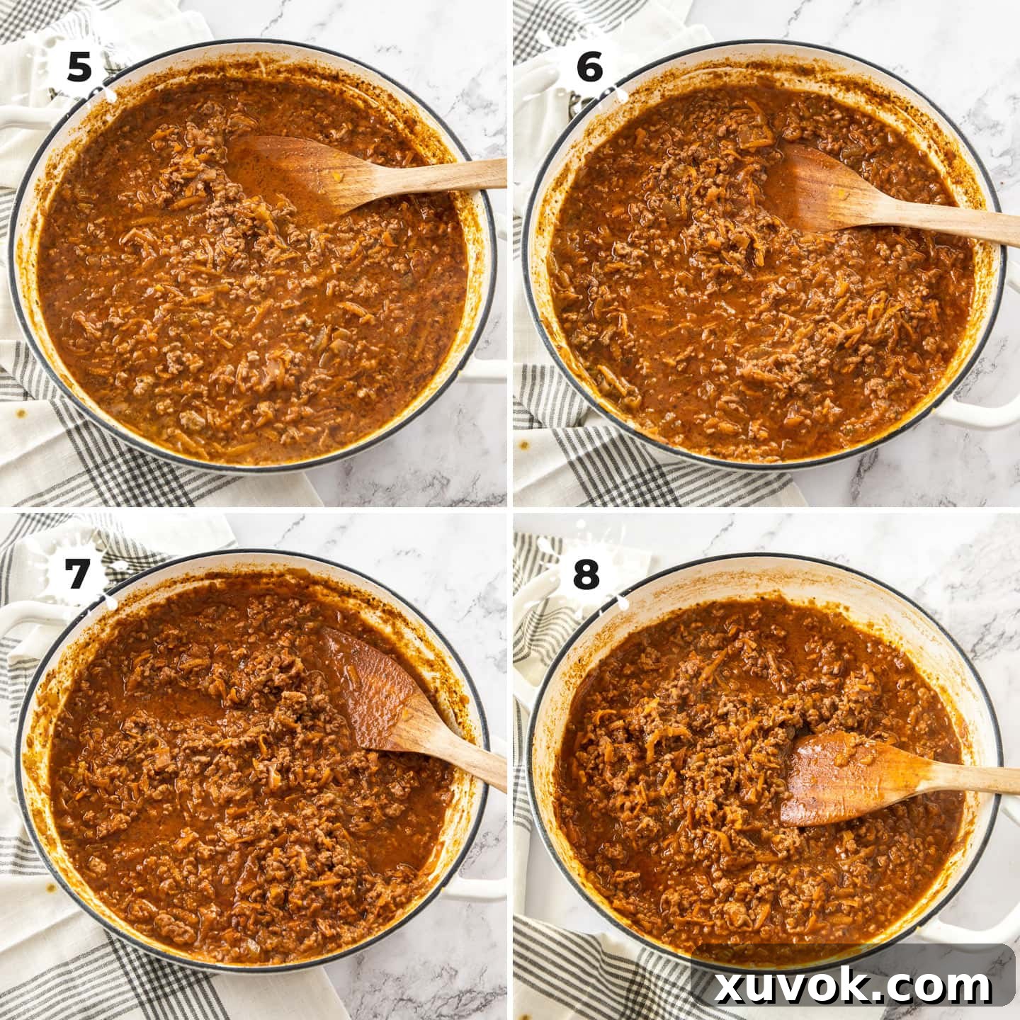 Meat sauce slowly reducing in a white pan.