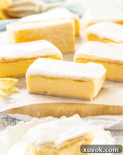7 pieces of custard slice on a wooden board.
