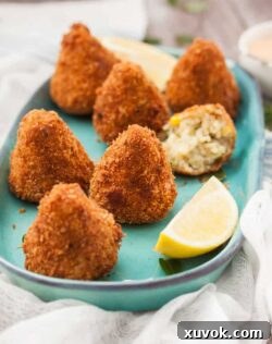 These Sweet Corn Arancini are little handfuls of risotto, that are then coated in breadcrumbs and deep fried to golden perfection. Completely vegetarian too!