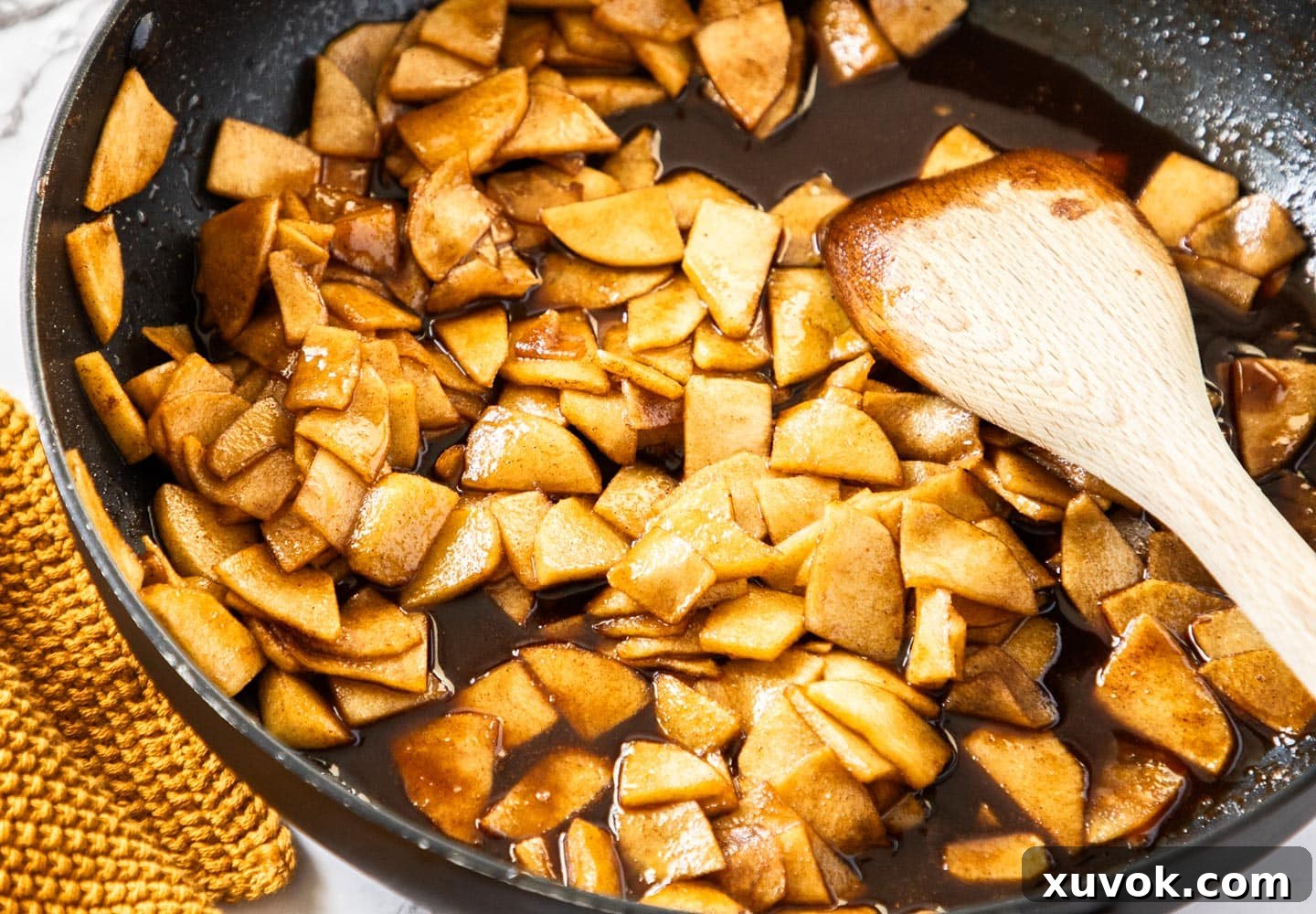 The caramel apple filling in a pan.