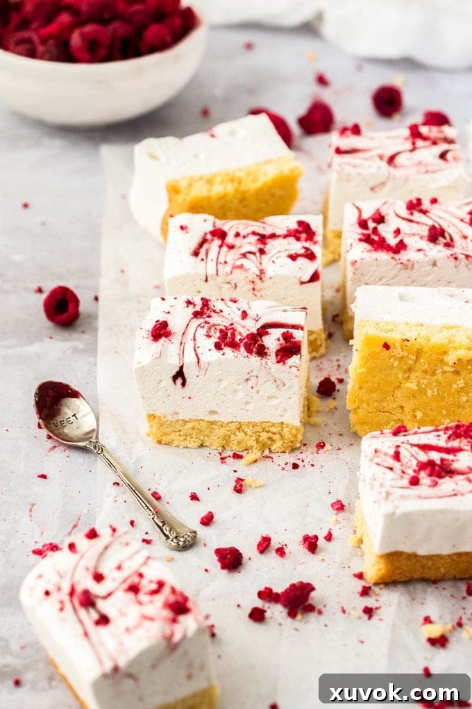 8 squares of marshmallow slice on a crumpled piece of white baking paper.