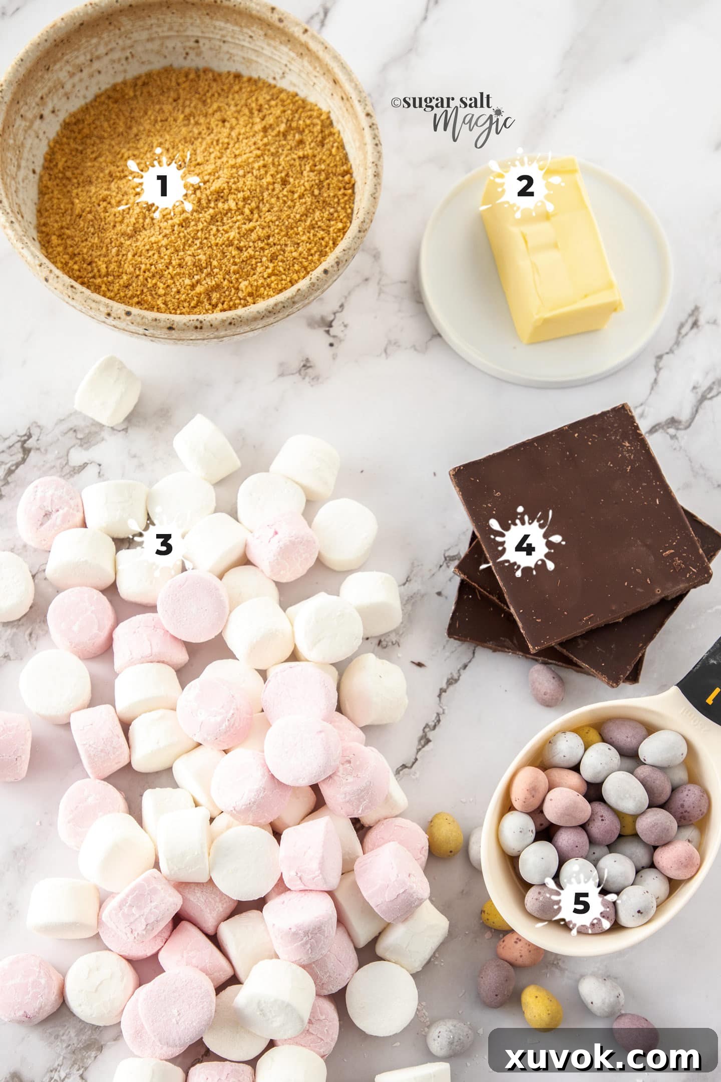 Ingredients for easter egg slice on a marble benchtop.