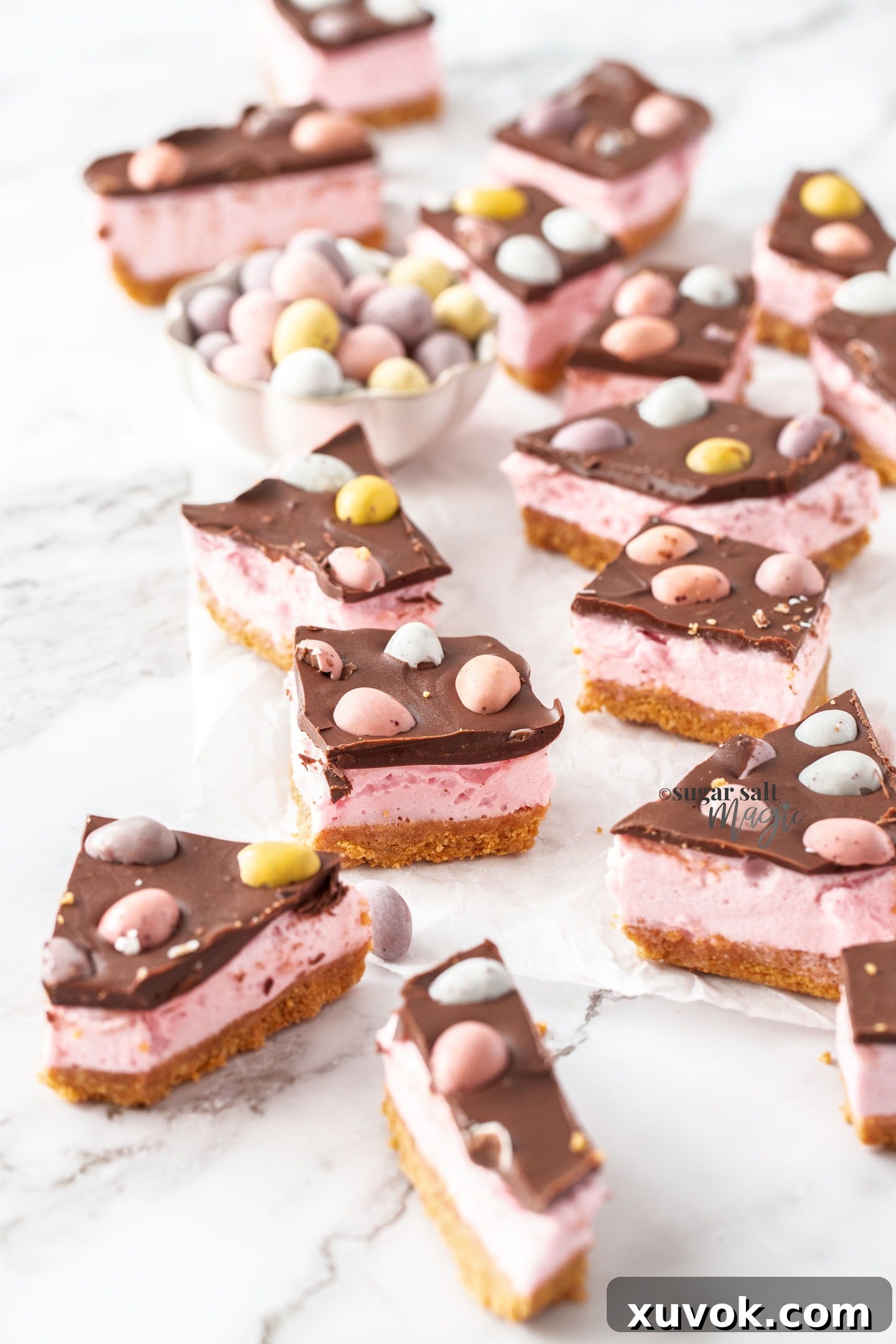 A batch of easter egg slice on a marble benchtop.