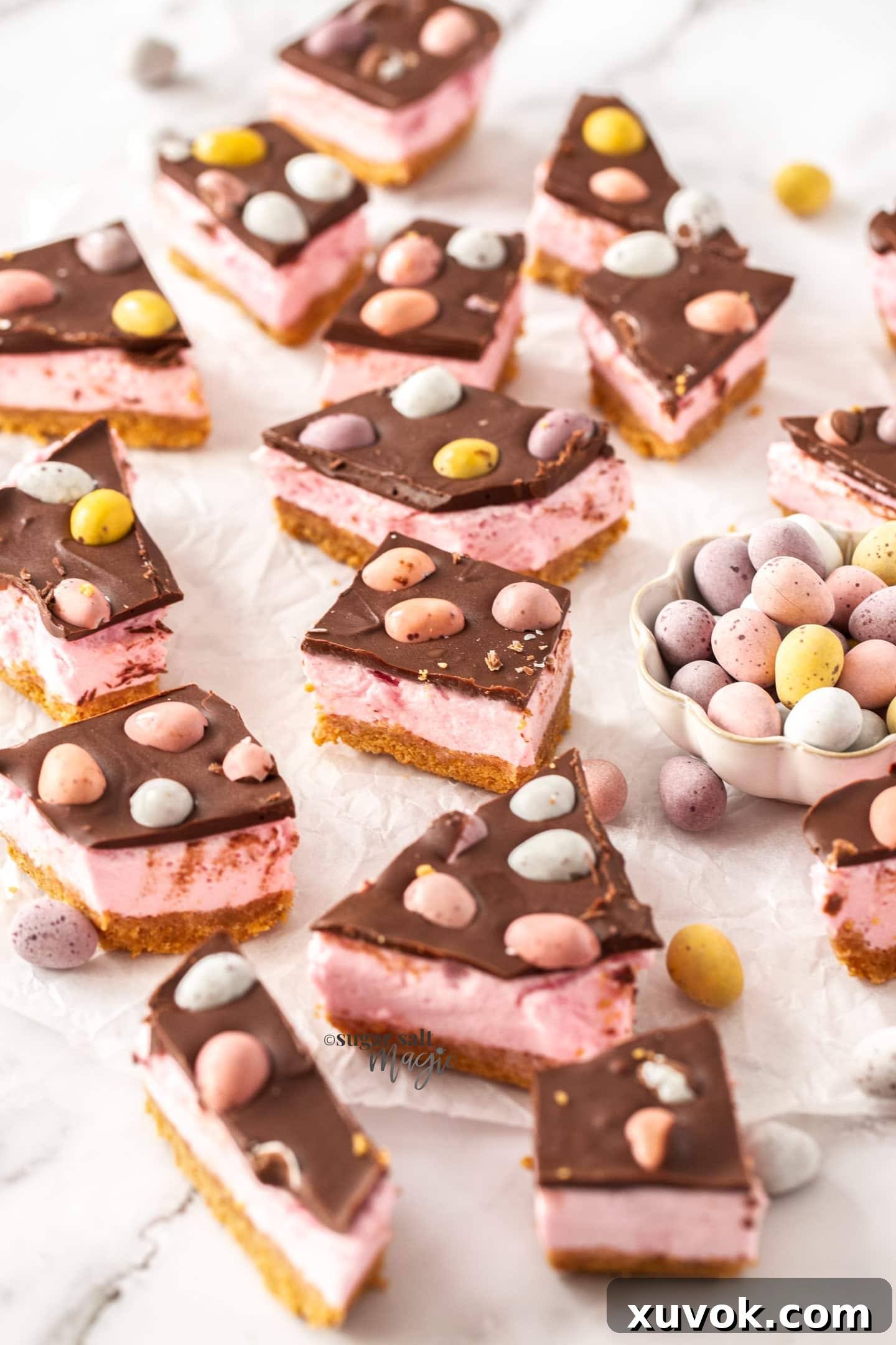 A batch of easter egg slice on a marble benchtop.