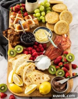 A wooden board filled with breakfast foods.