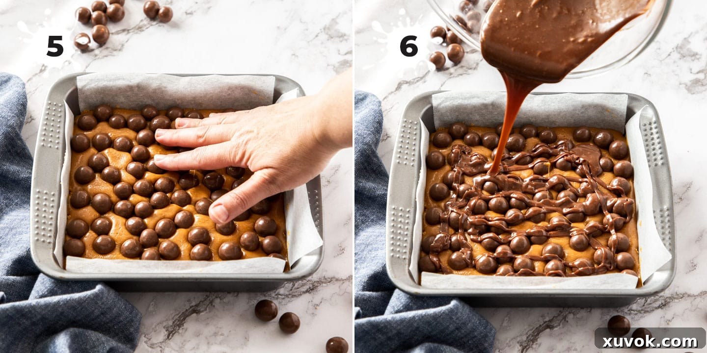 Maltesers being gently pressed into the set caramel layer, followed by a generous drizzle of chocolate ganache over the top.