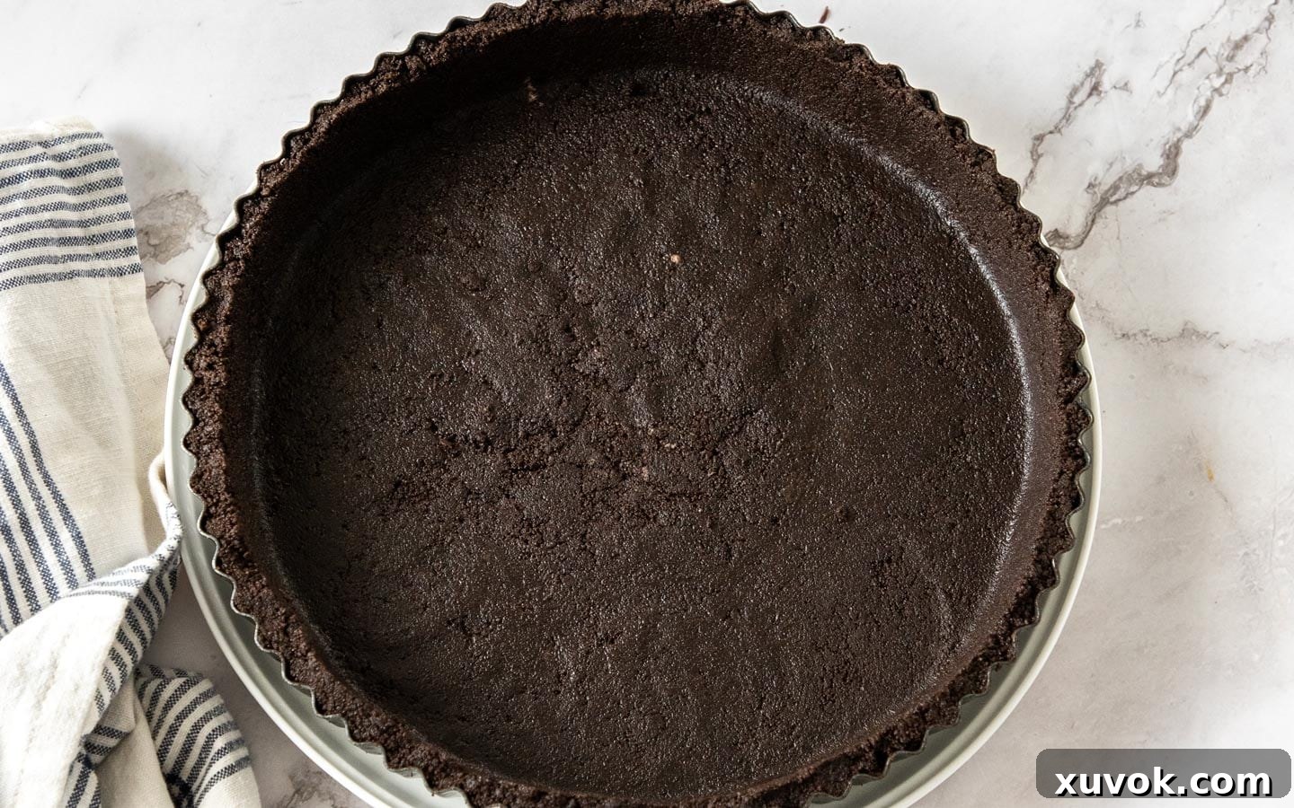 The cookie base in the tart pan.