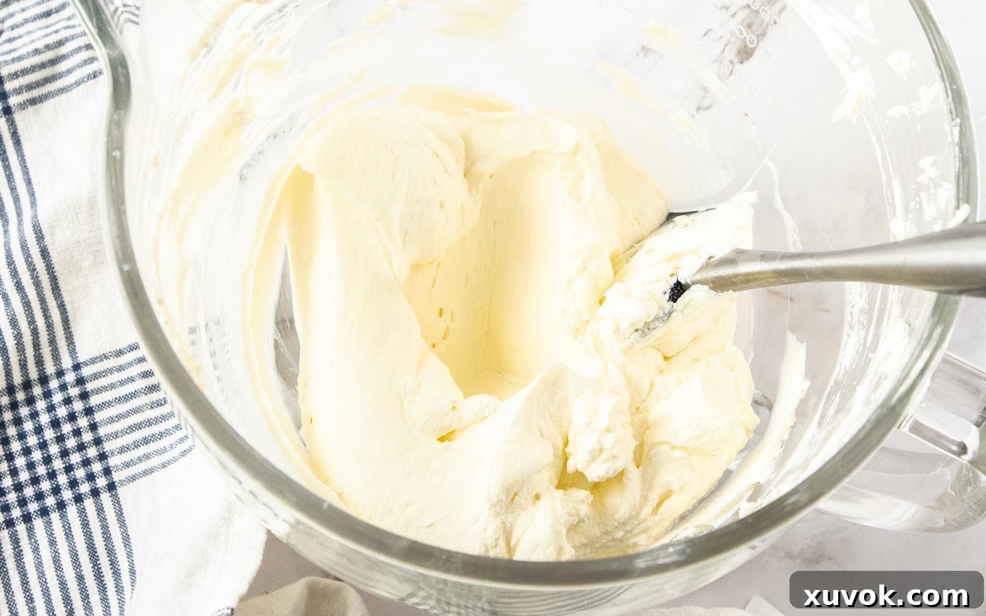 The whipped cream in a large bowl.