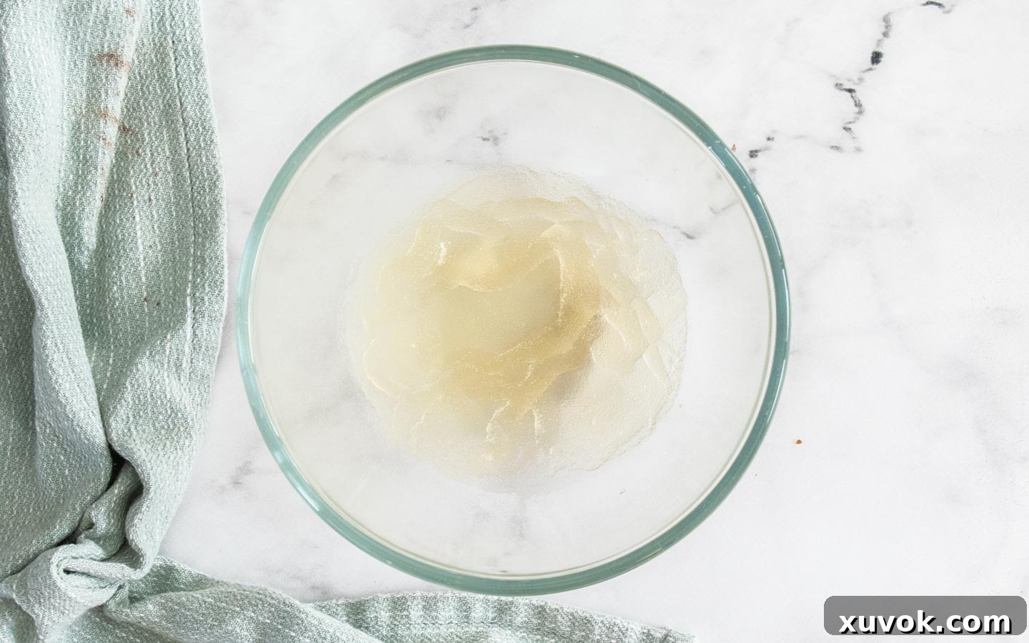 The gelatine for the mirror glaze in a bowl.