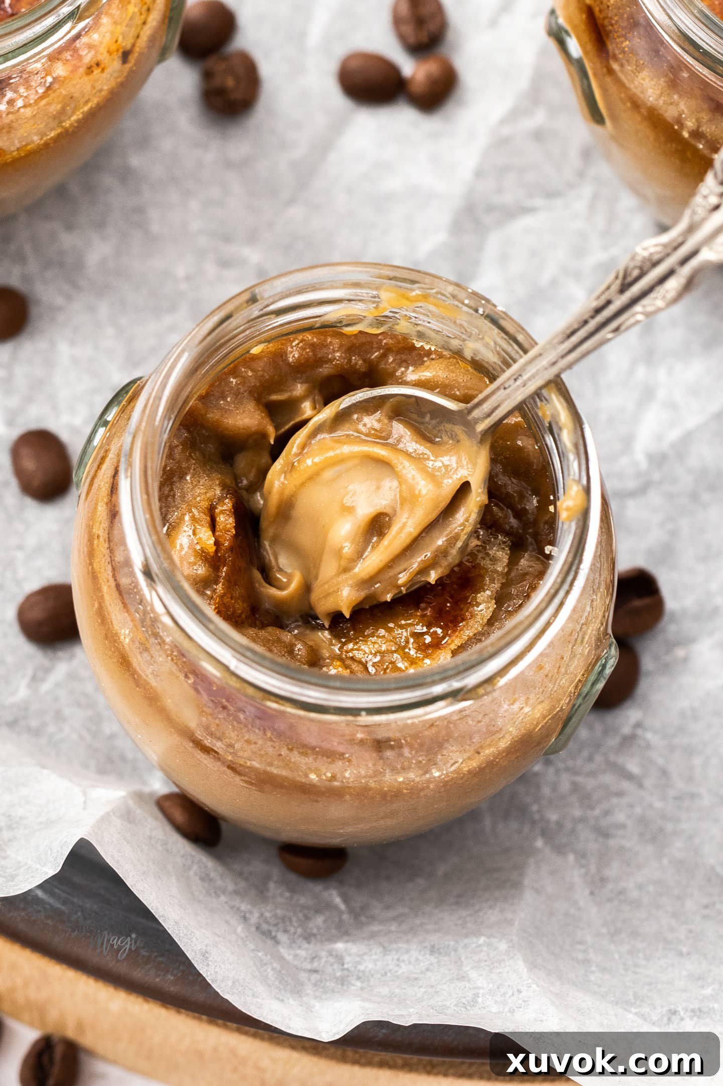 Top down view of the coffee creme brulee on a spoon in the jar.