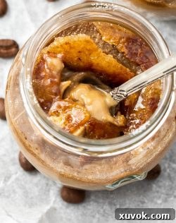 A spoon digging into the coffee creme brulee.