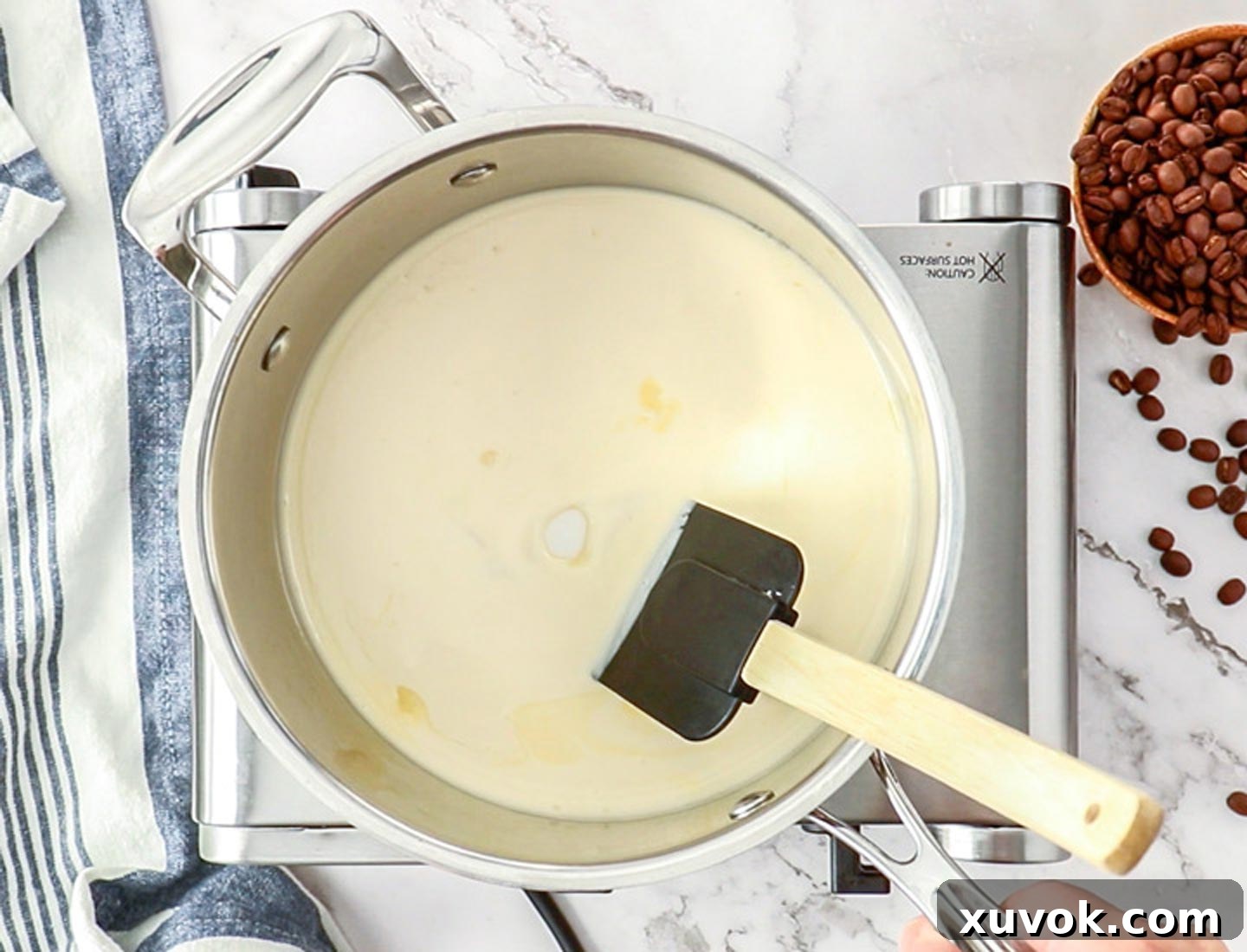 The cream and sugar in a pan.