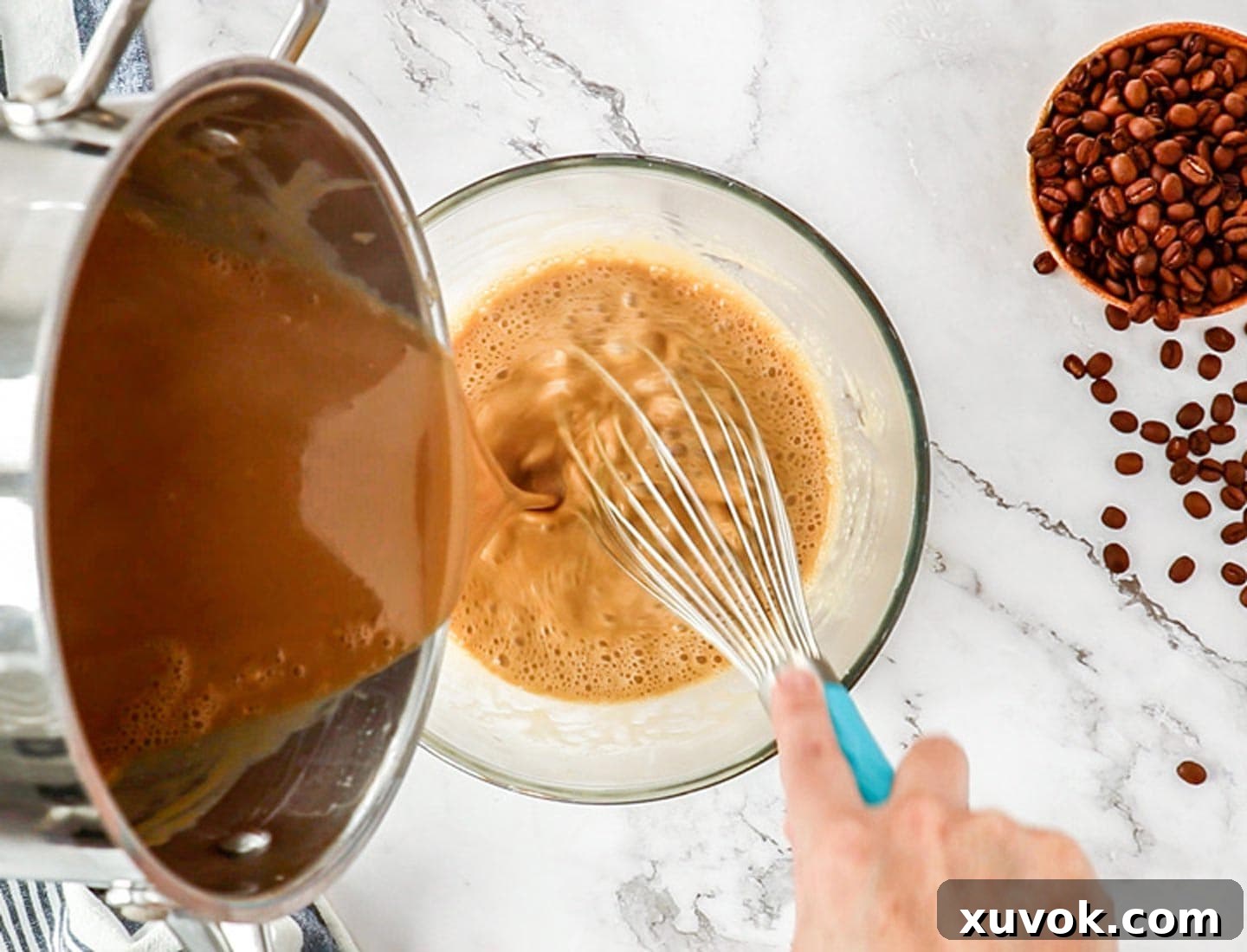 Pouring the coffee cream into the eggs.