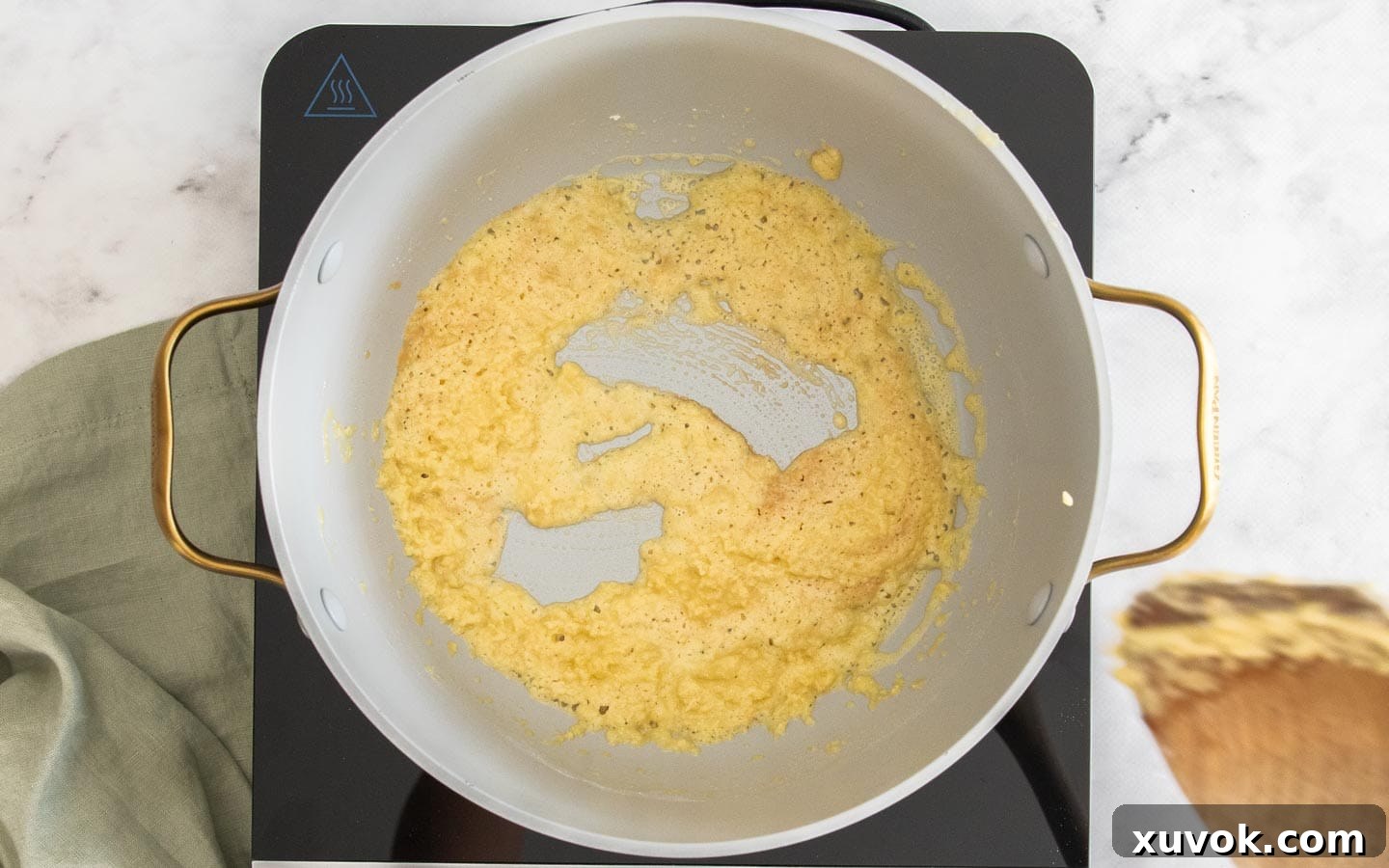 The butter and flour foaming in the pan.