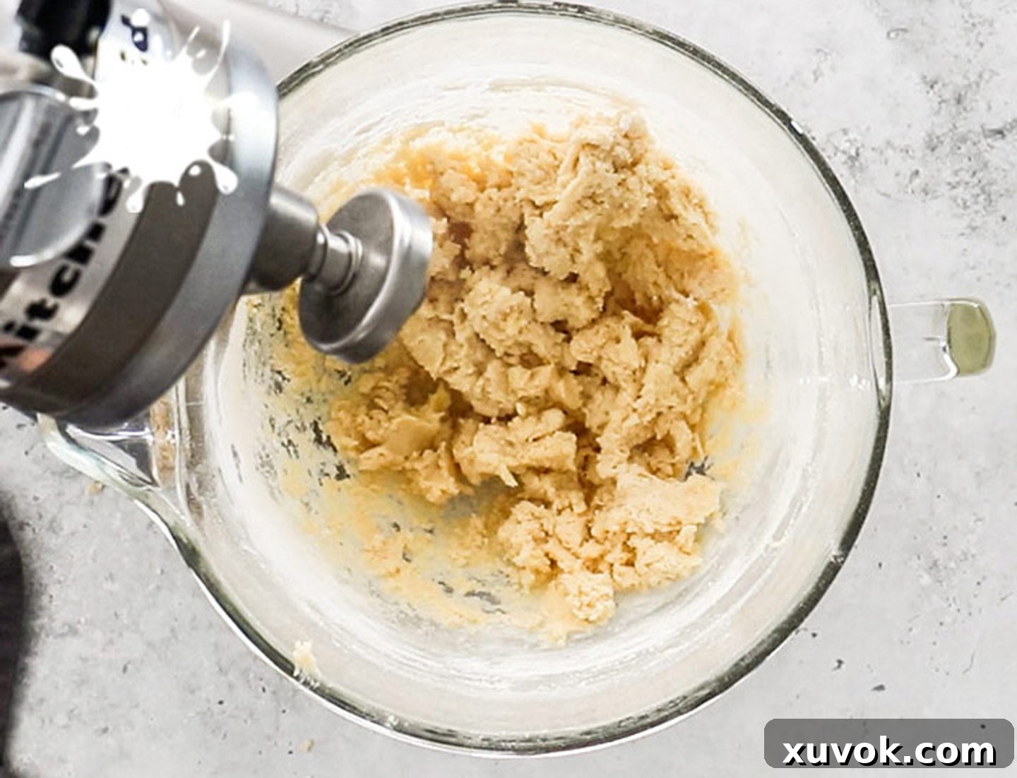 The mixed tart shell dough in the standmixer bowl.