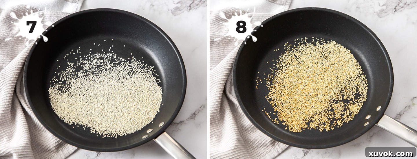 Sesame seeds being toasted in a frying pan.