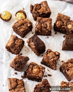 Top down view of a batch of brownies filled with Ferrero Rocher.