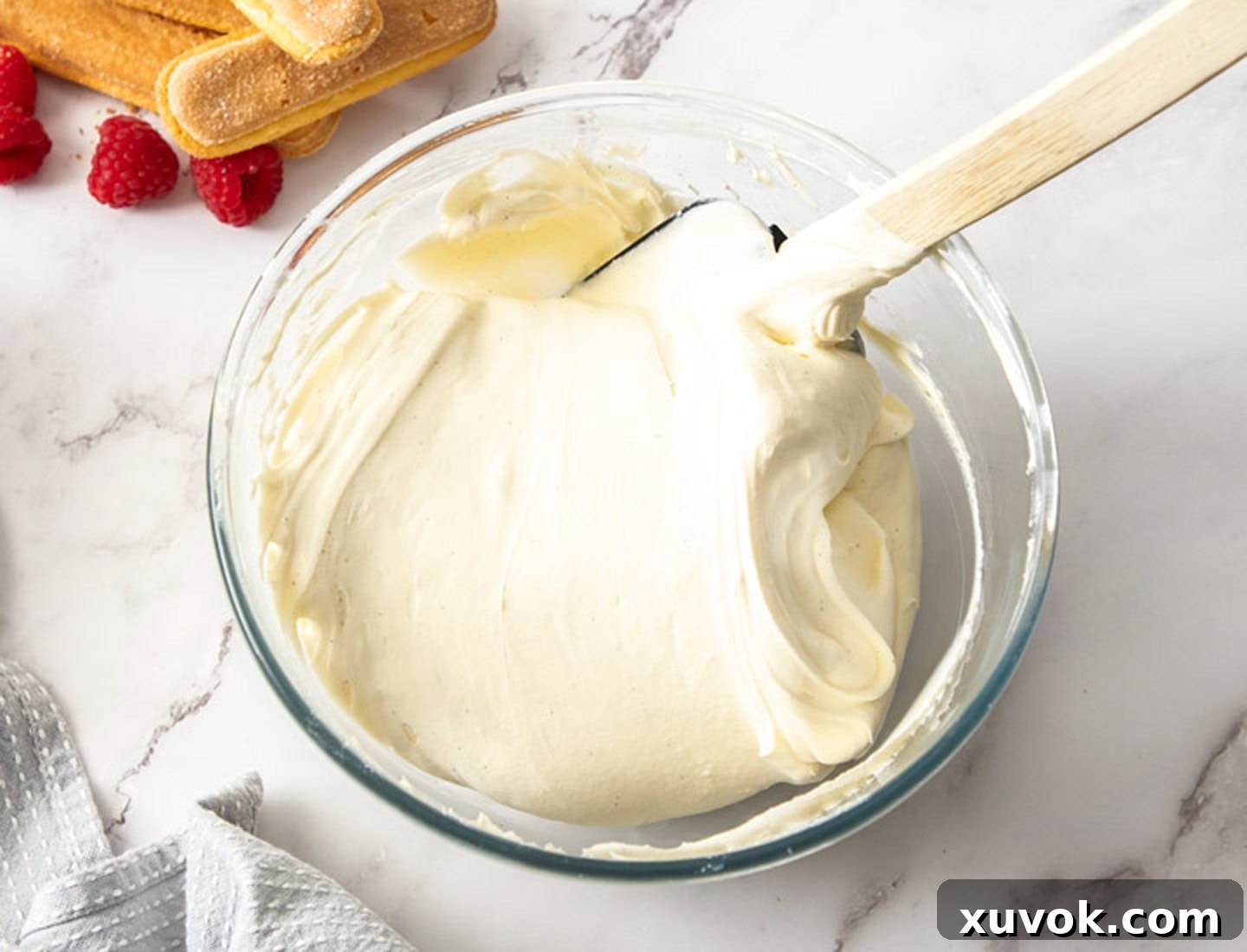 The perfectly folded mascarpone and whipped cream mixture, showcasing its smooth and airy consistency in a mixing bowl, ready for layering.
