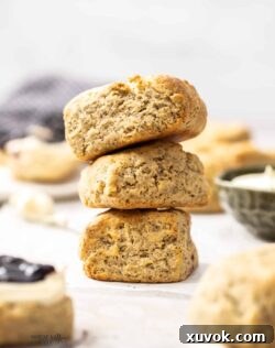 A stack of 3 freshly baked Earl Grey scones, golden brown and inviting.