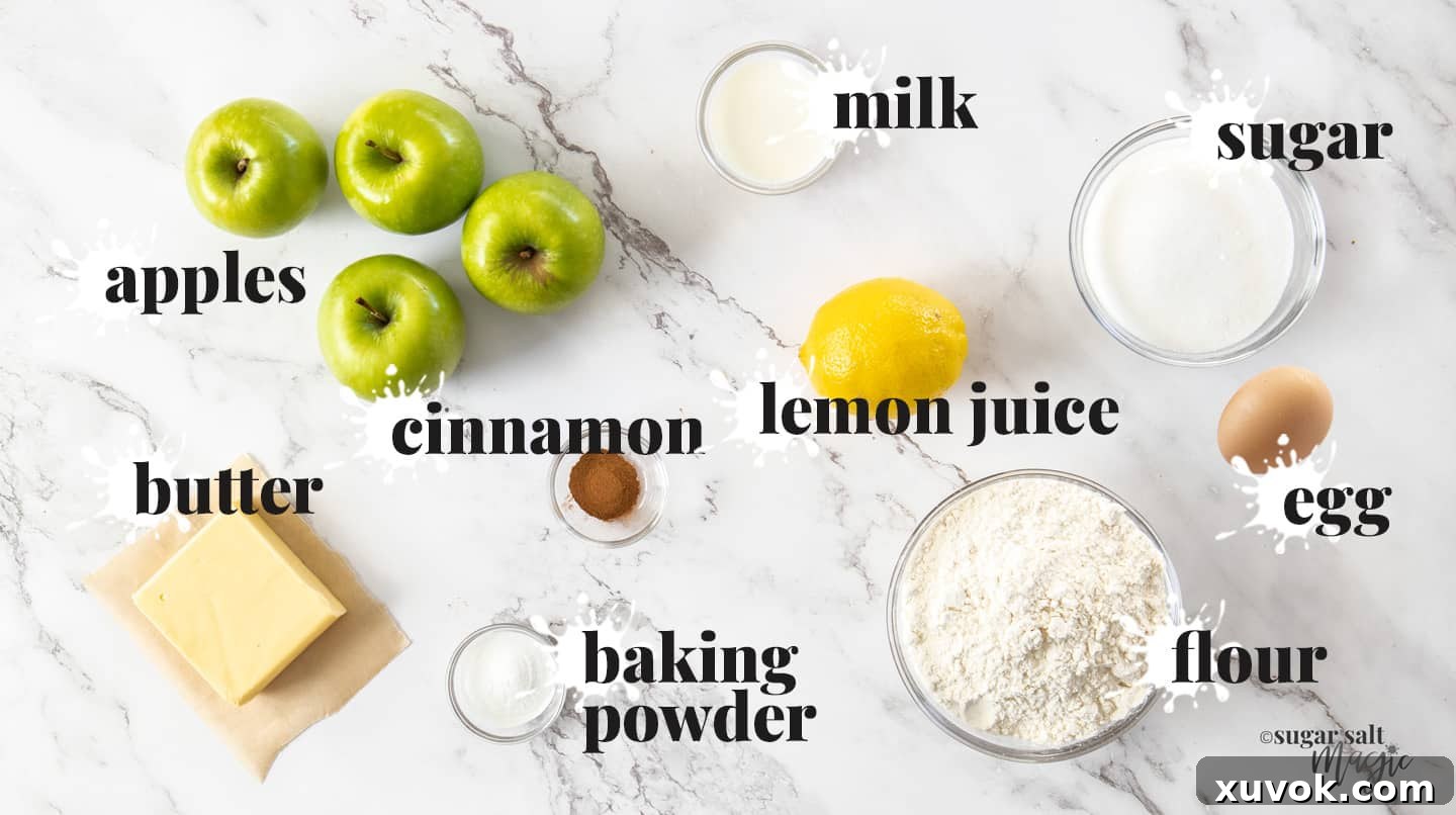 A beautiful flat lay of fresh ingredients for apple shortcake laid out on a pristine marble countertop, featuring apples, butter, flour, sugar, eggs, and cinnamon.