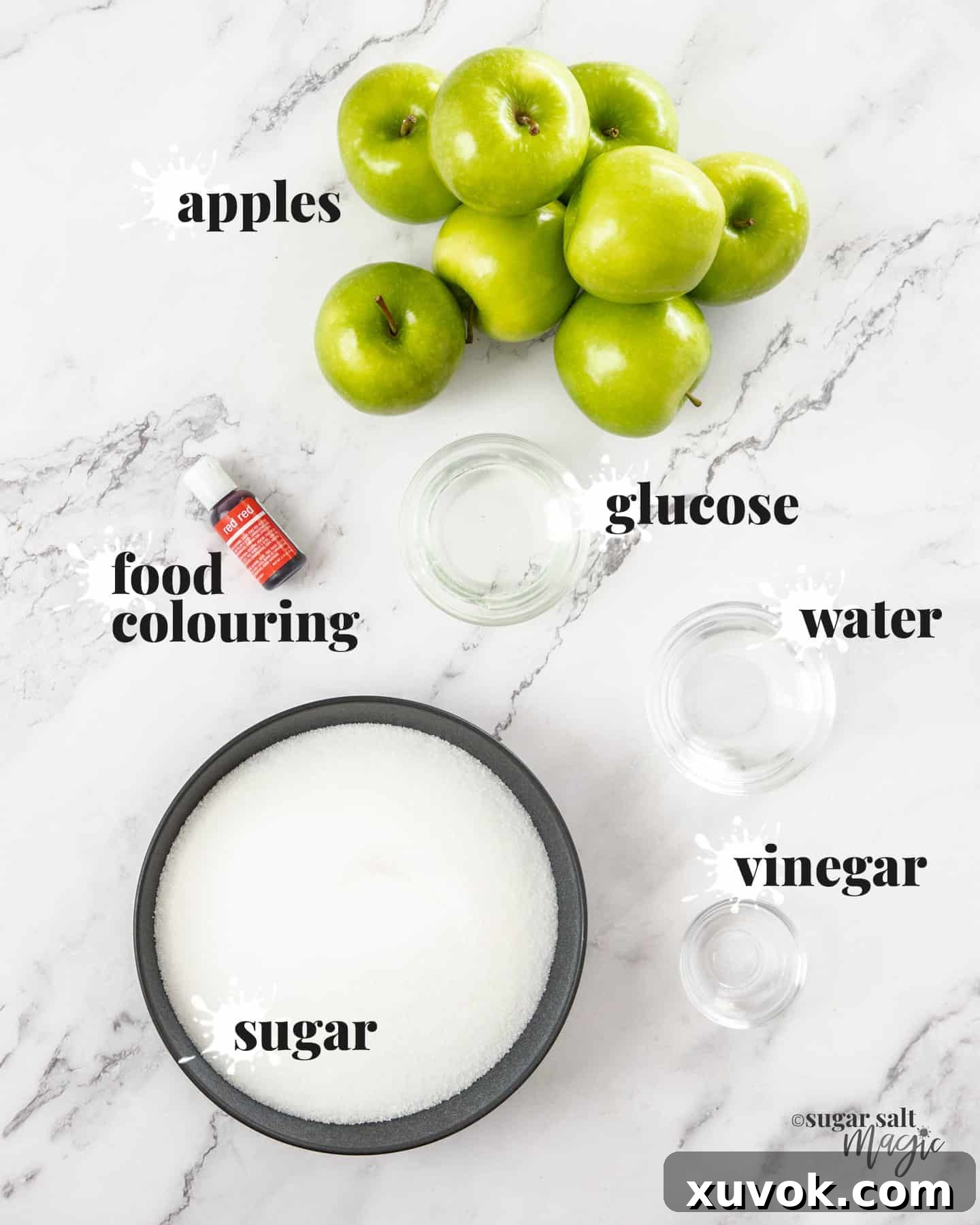 Ingredients for toffee apples on a marble bench top.