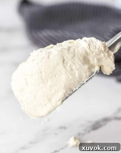 A spatula loaded with Swiss meringue buttercream.