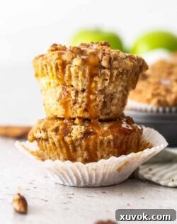 Two stacked muffins with caramel drizzling down the sides, an inviting image for a recipe card.