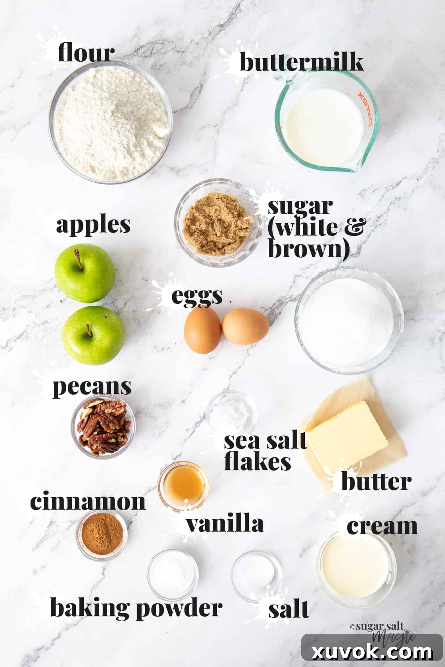 Ingredients for caramel apple muffins laid out on a marble benchtop.