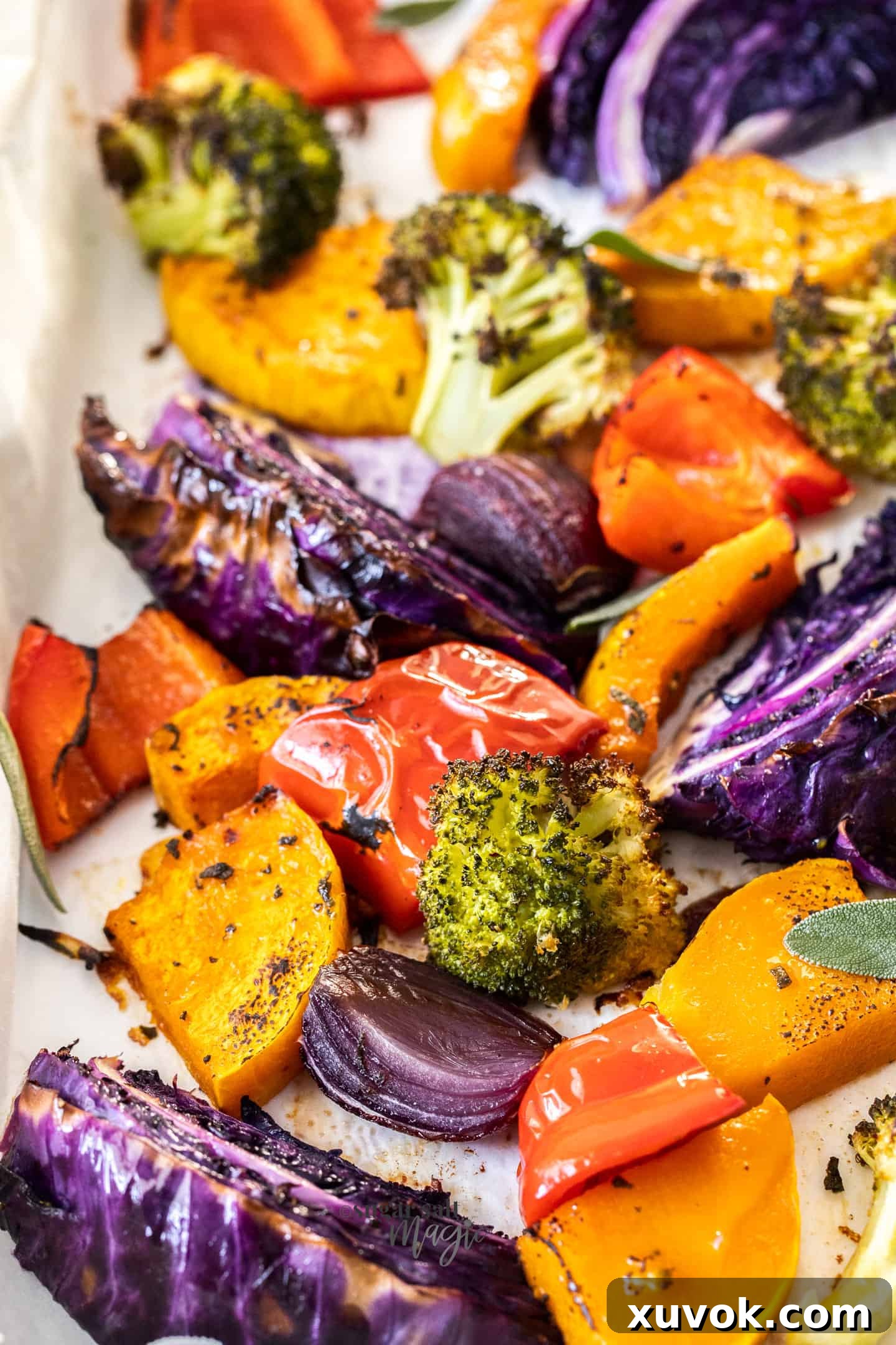 Closeup view of a colorful assortment of roasted vegetables, showcasing their caramelized edges and vibrant hues.