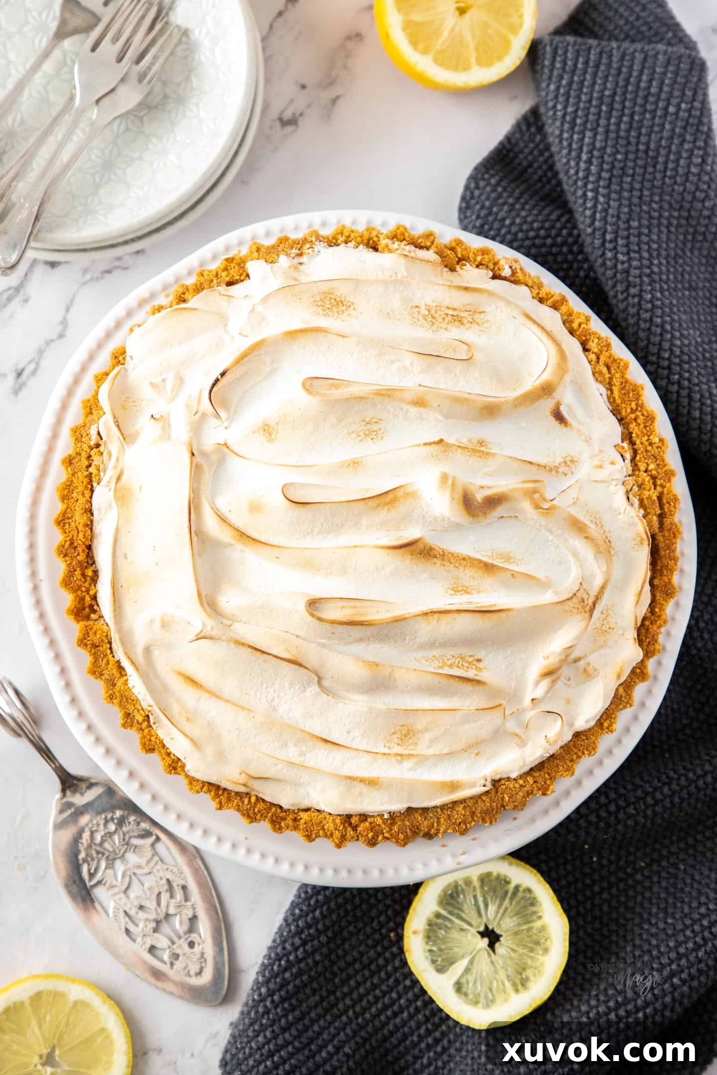 Close-up view of the perfectly toasted, golden-brown meringue peaks on a lemon meringue pie.