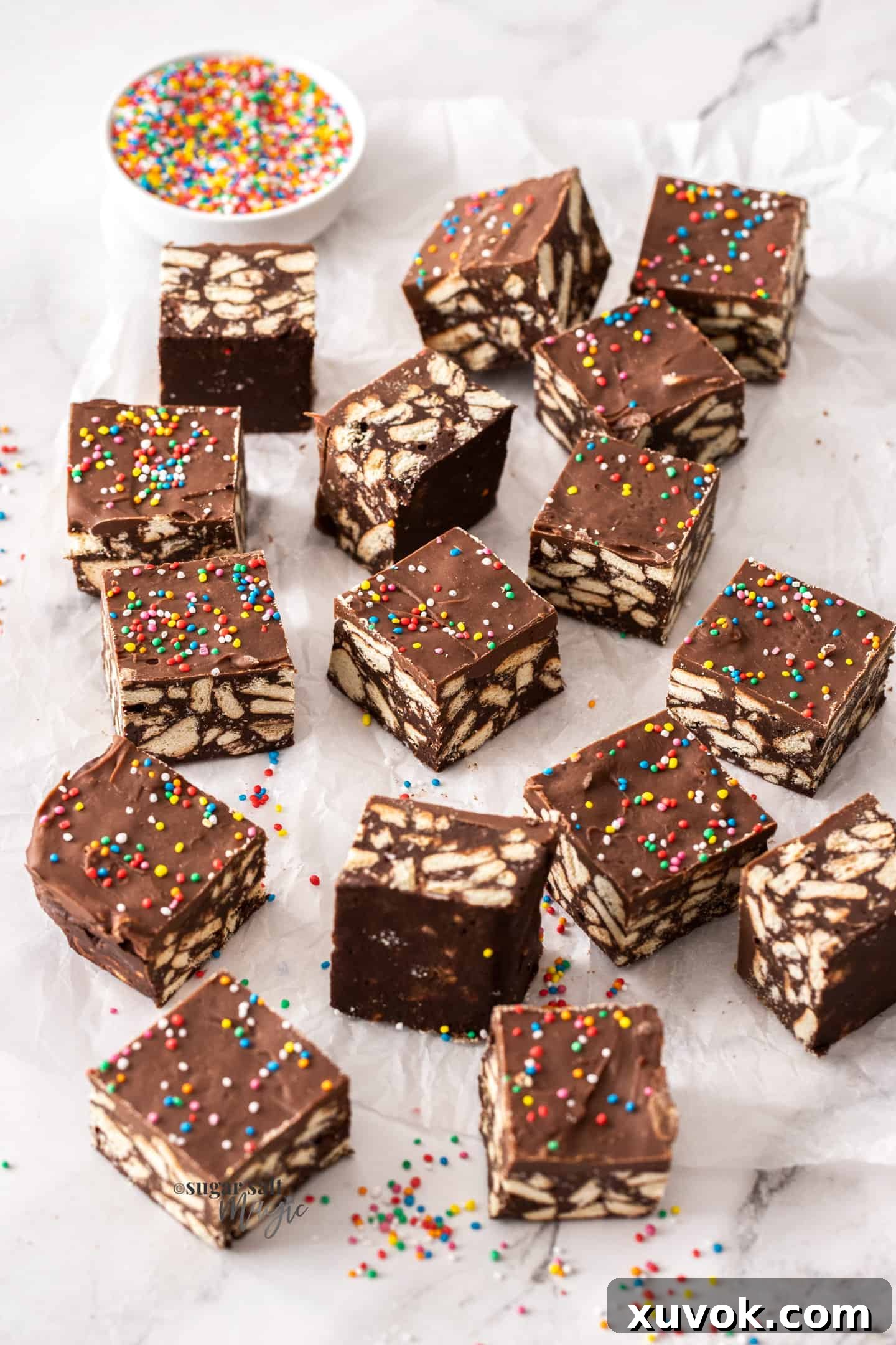 Another appealing shot of chocolate hedgehog slice squares on baking paper, highlighting their delightful texture and finish.
