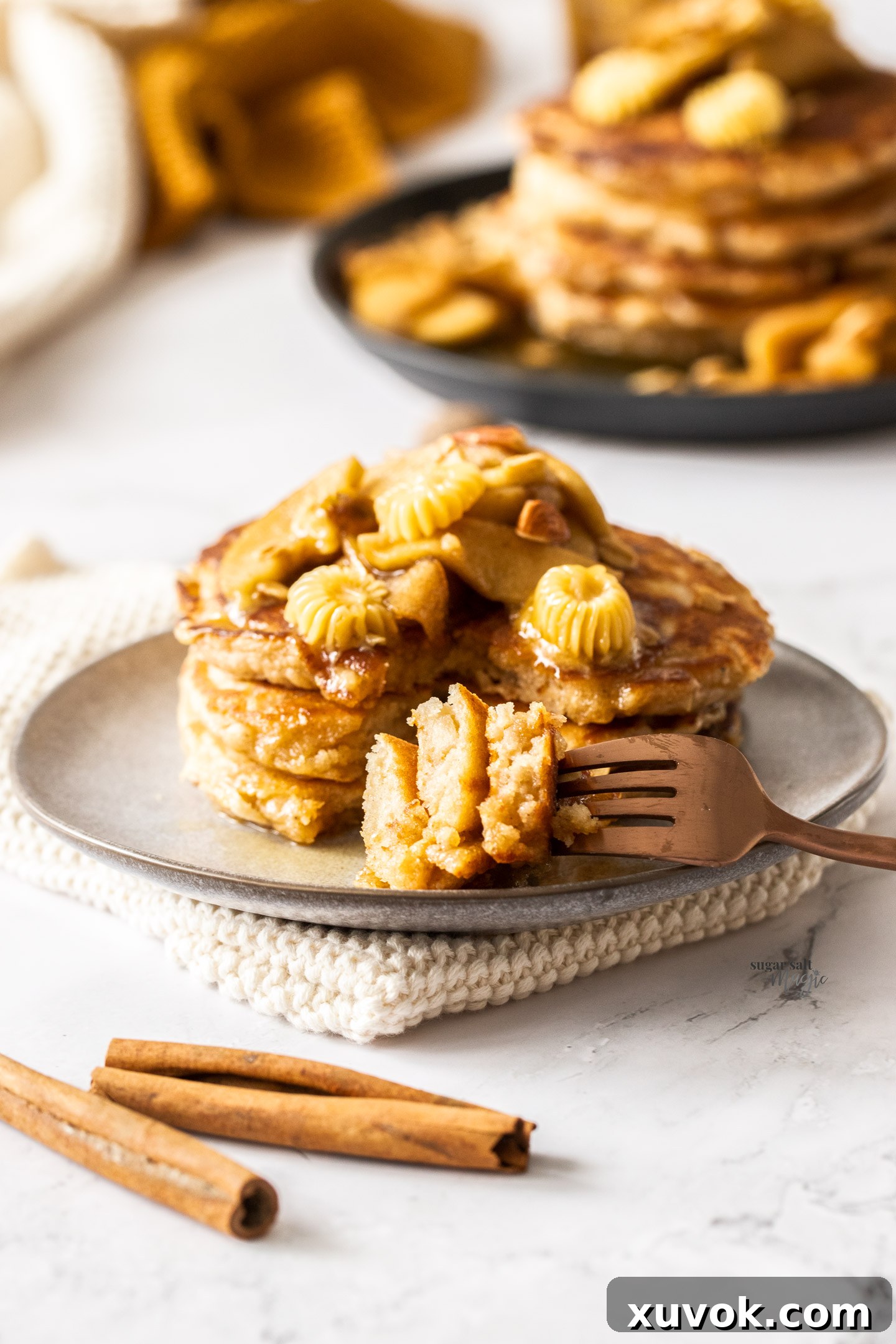 A fork with some cut pancakes showing the inside.