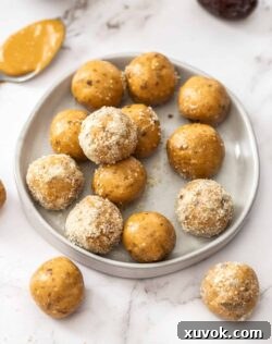 A batch of peanut butter bliss balls on a small dish.