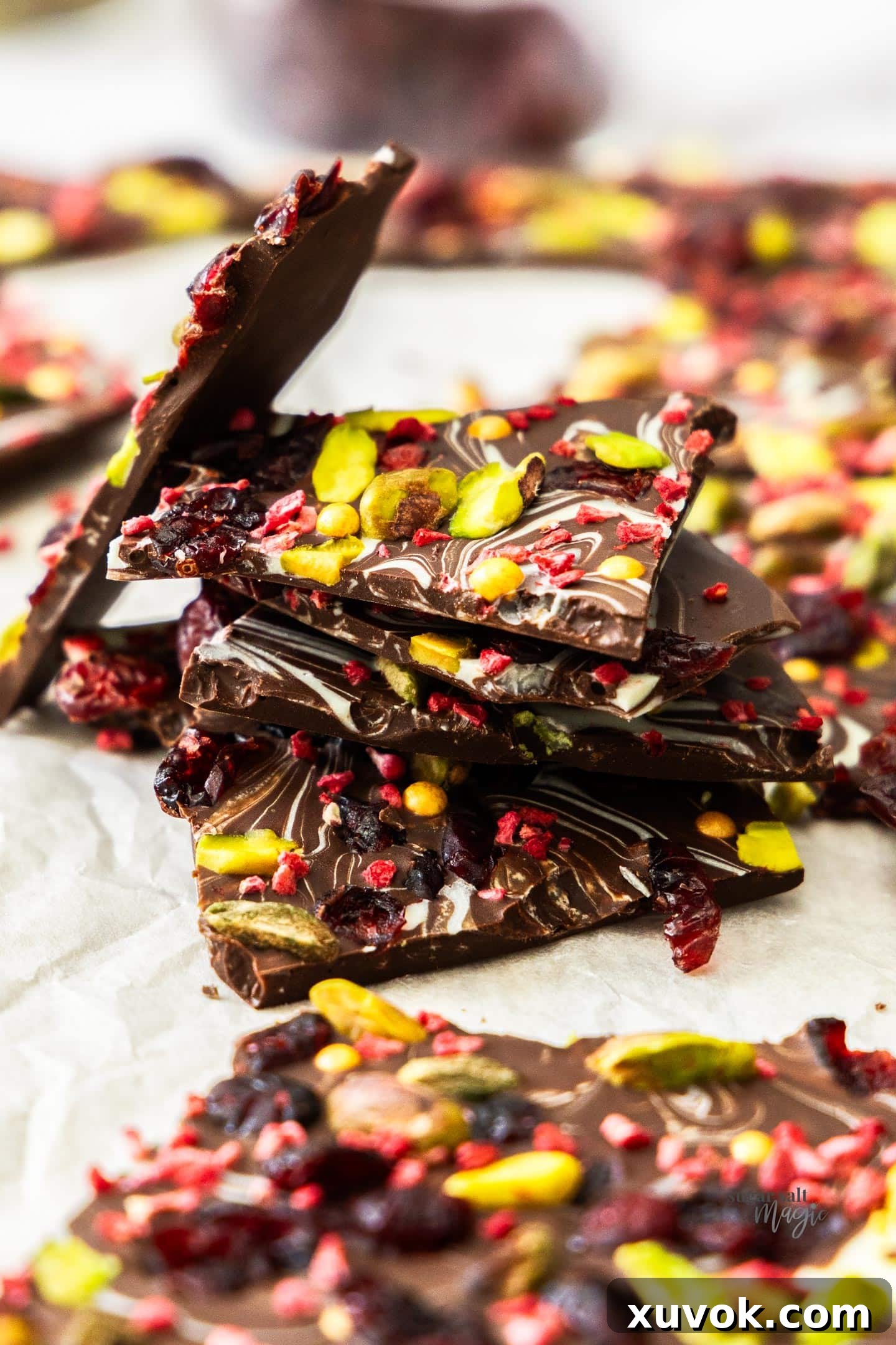 A stack of perfectly broken Christmas chocolate bark shards, ready to be enjoyed.