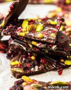 A pile of homemade chocolate Christmas bark shards, ready to be enjoyed or gifted.