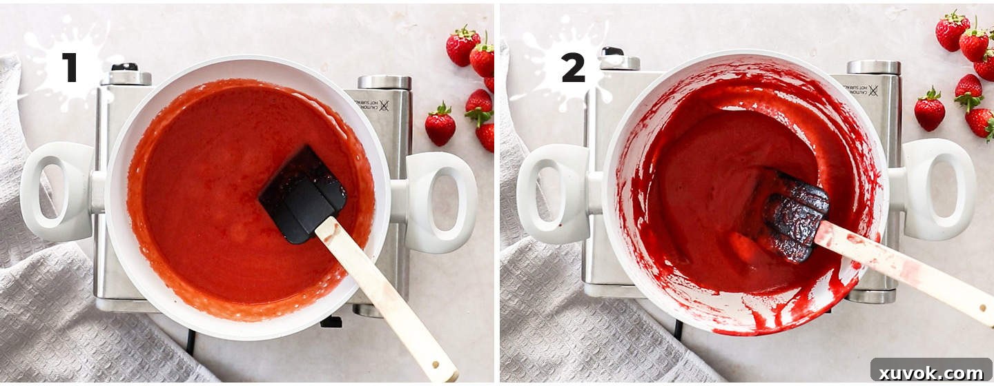 Strawberry puree reducing in a saucepan on the stove.