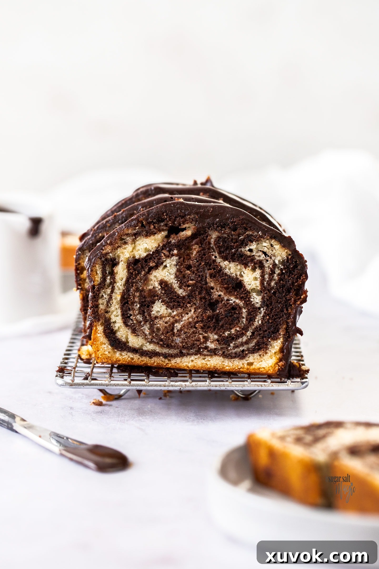 Front on view of a cake slice showing the marbled inside.