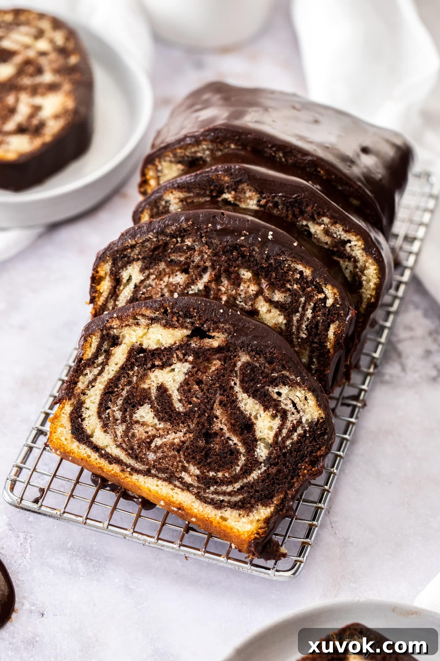 Slices of marble cake on a wire rack.