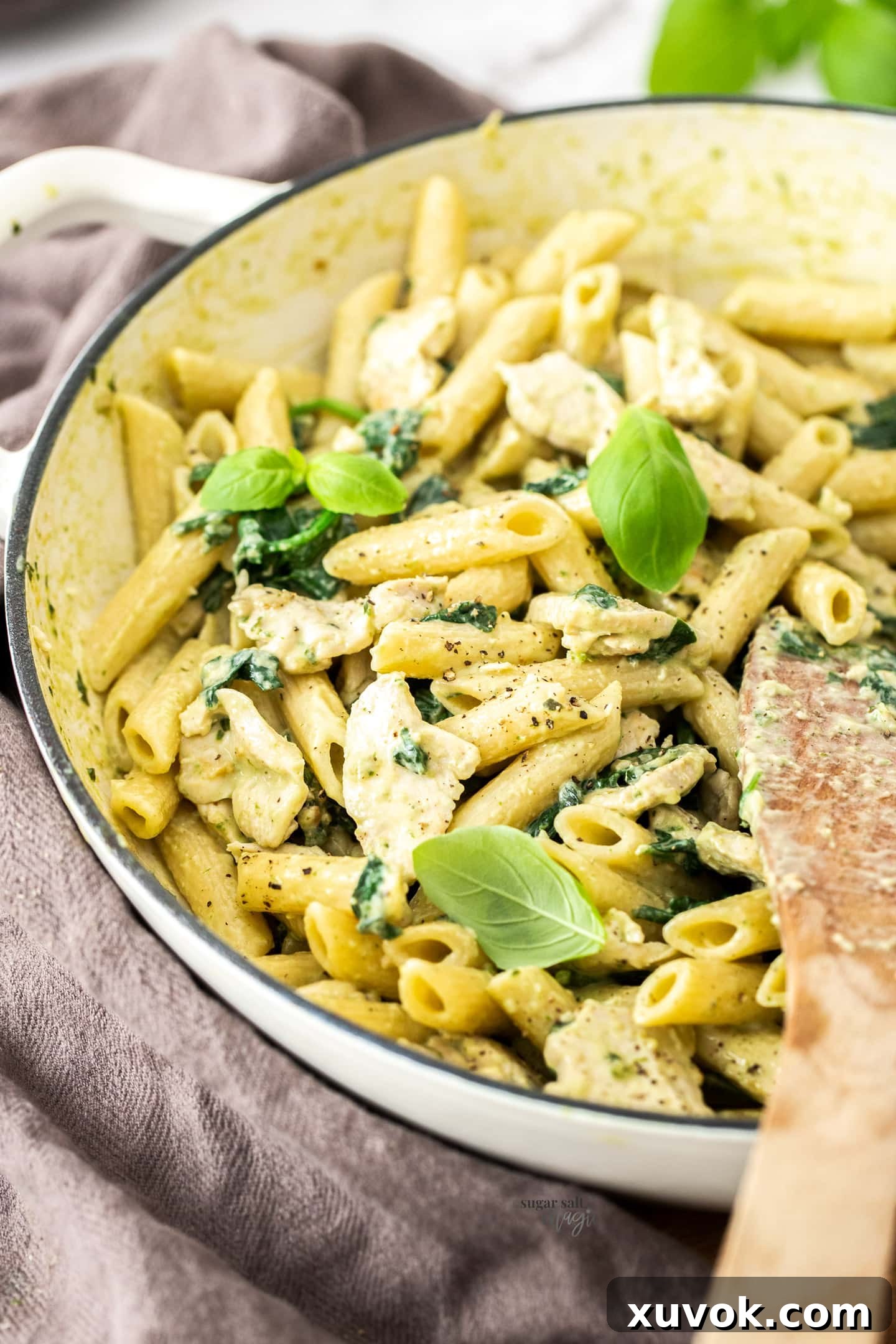Creamy chicken pasta in a large skillet, ready to be served.