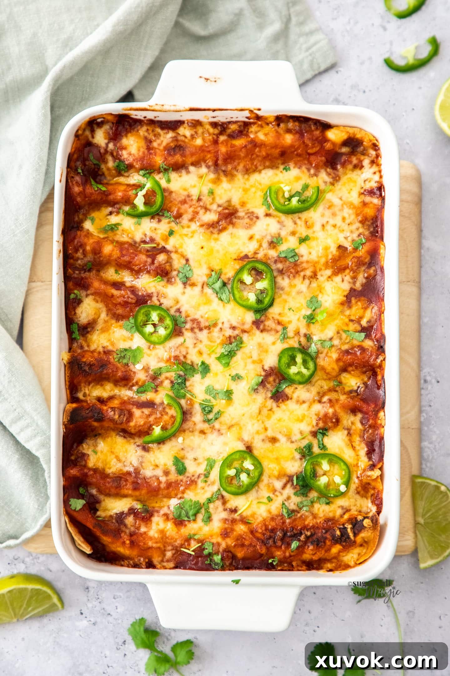 Top down view of enchiladas in a baking dish.