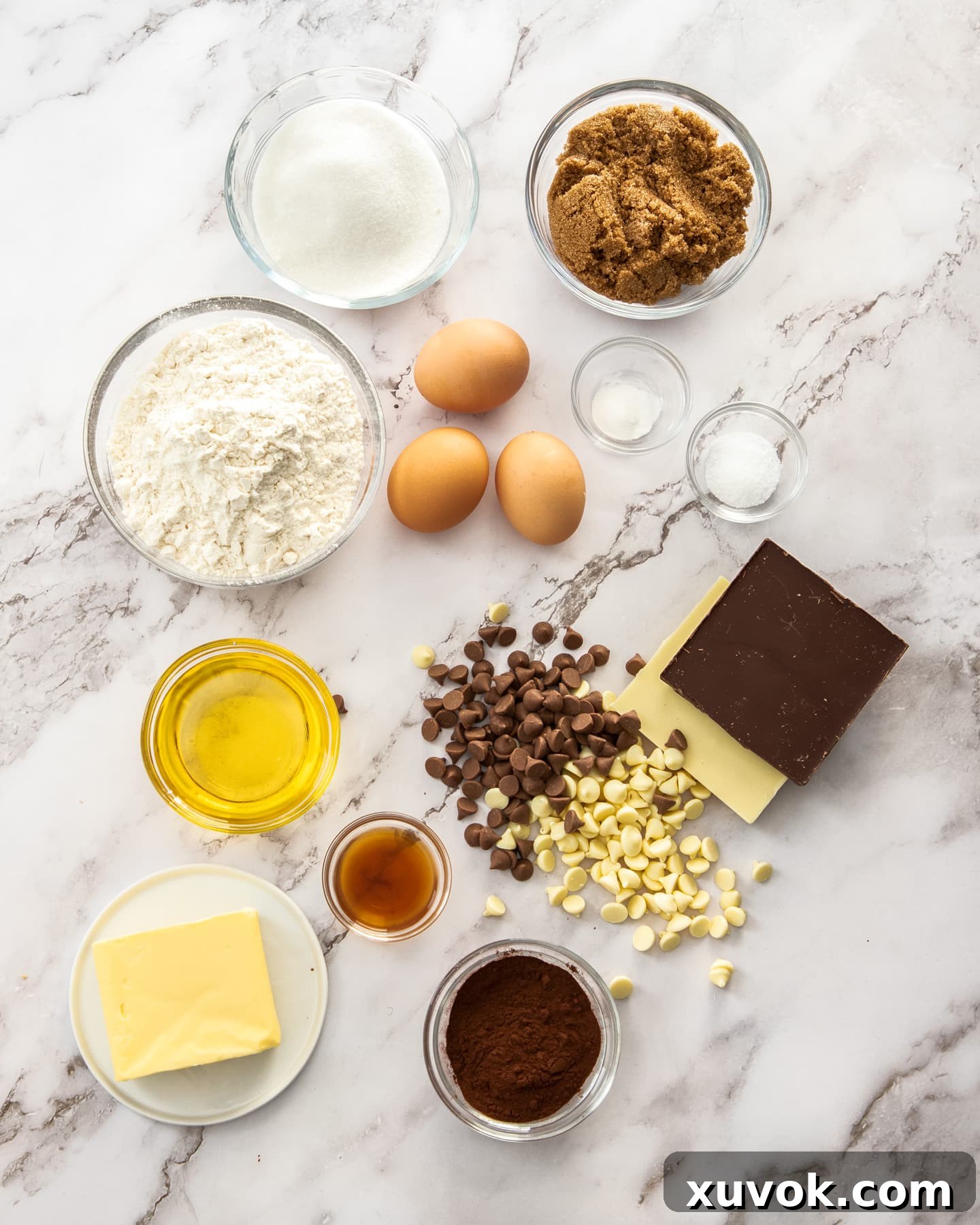 Ingredients for brownie blondies on a marble surface.