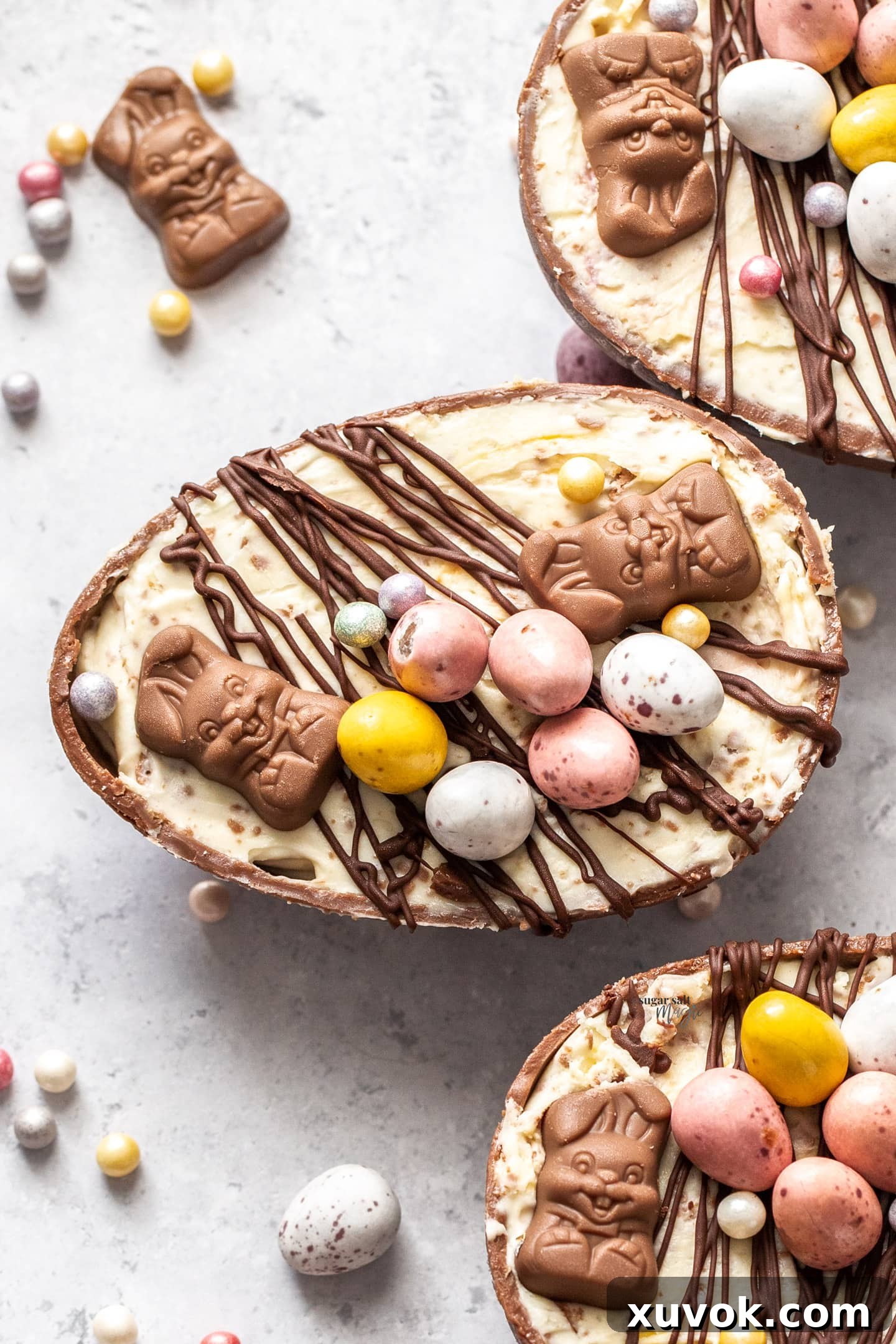 Top-down view of beautifully arranged Easter egg cheesecakes, showcasing their creamy filling and festive toppings.