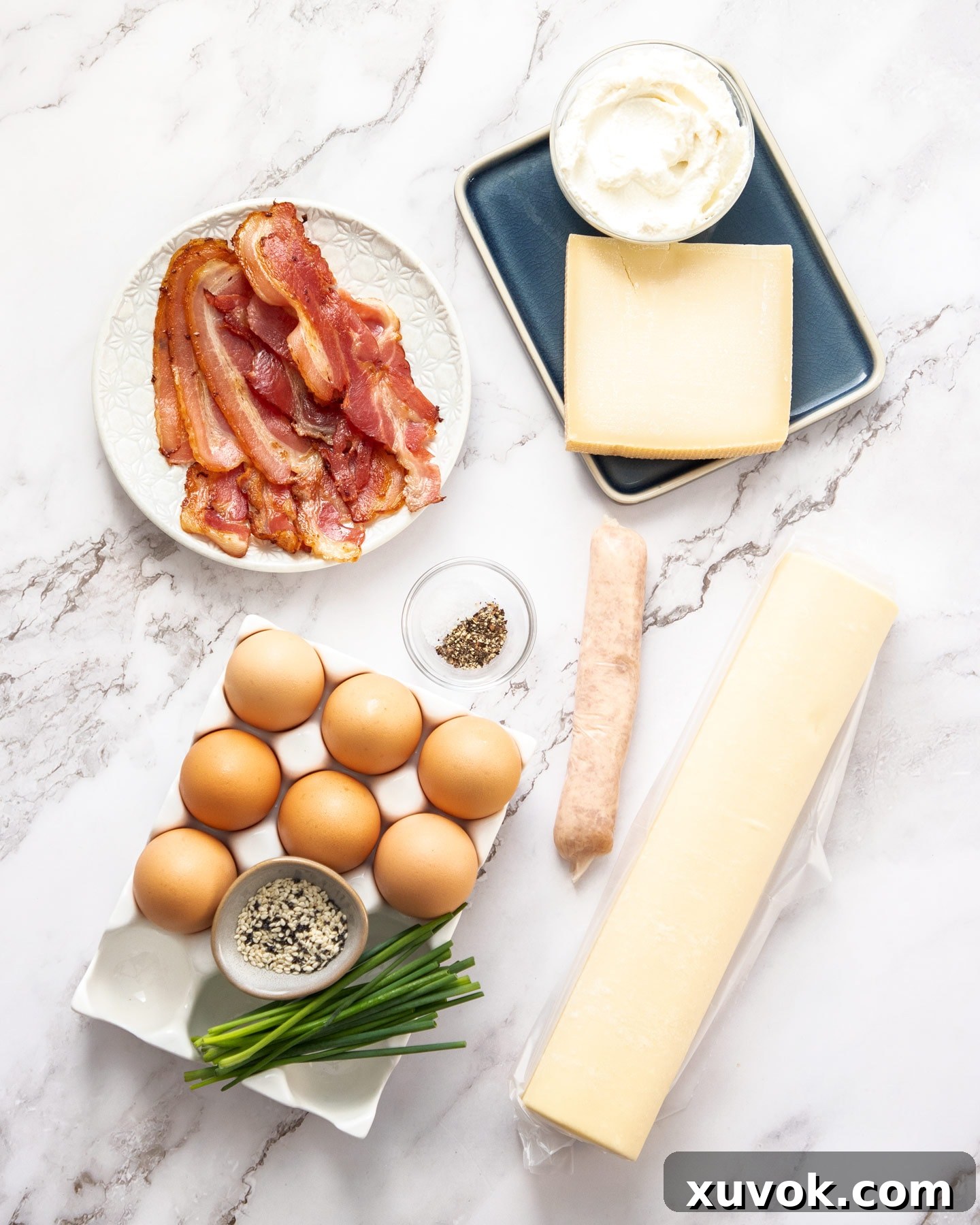 Ingredients for breakfast tart on a marble benchtop.