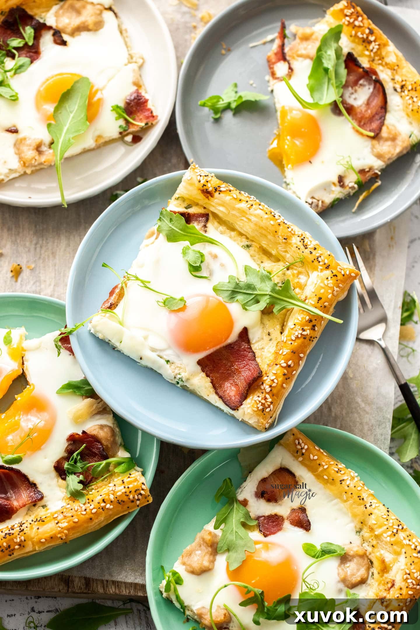 Top down view of slices of breakfast tart on colourful plates.