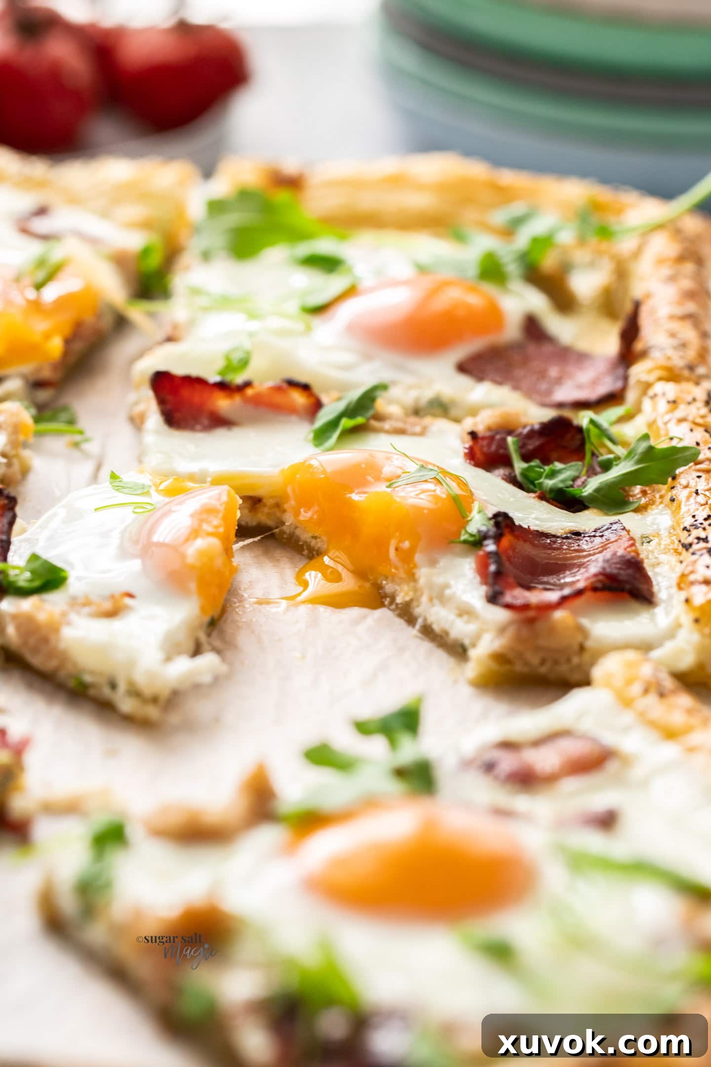 Closeup of a gooey yolk in a slice of breakfast tart.