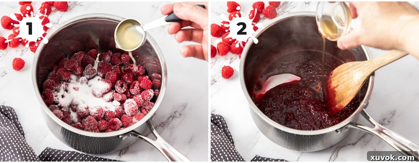 Raspberries and sugar in a saucepan being cooked.