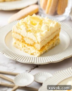 A slice of lemon tiramisu on a dessert plate.