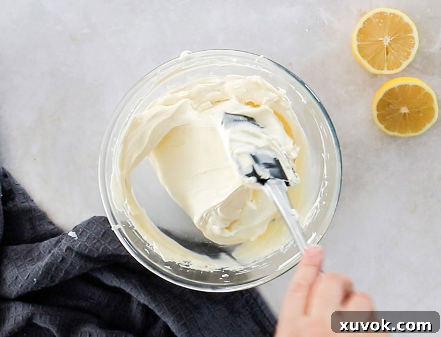 Folding the cream and mascarpone together.