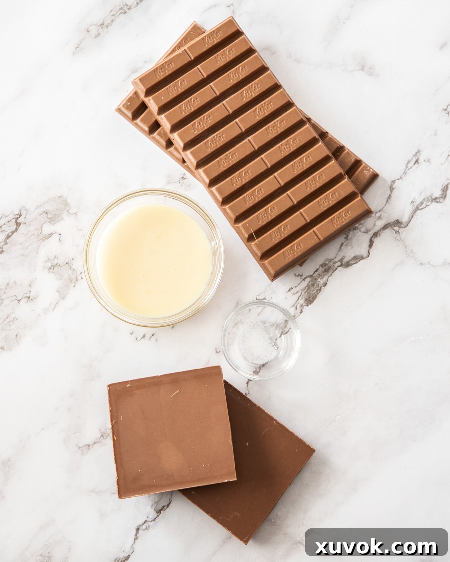 Ingredients for Kit Kat truffles on a marble surface.
