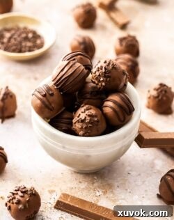 A marble bowl filled with kit kat truffles.